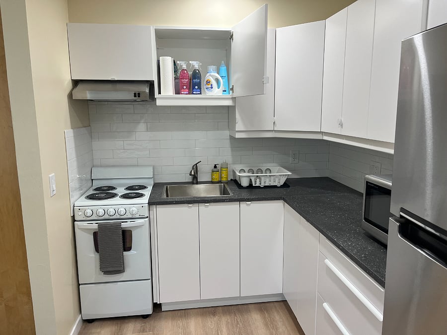 Oven, stove top, microwave, sink.