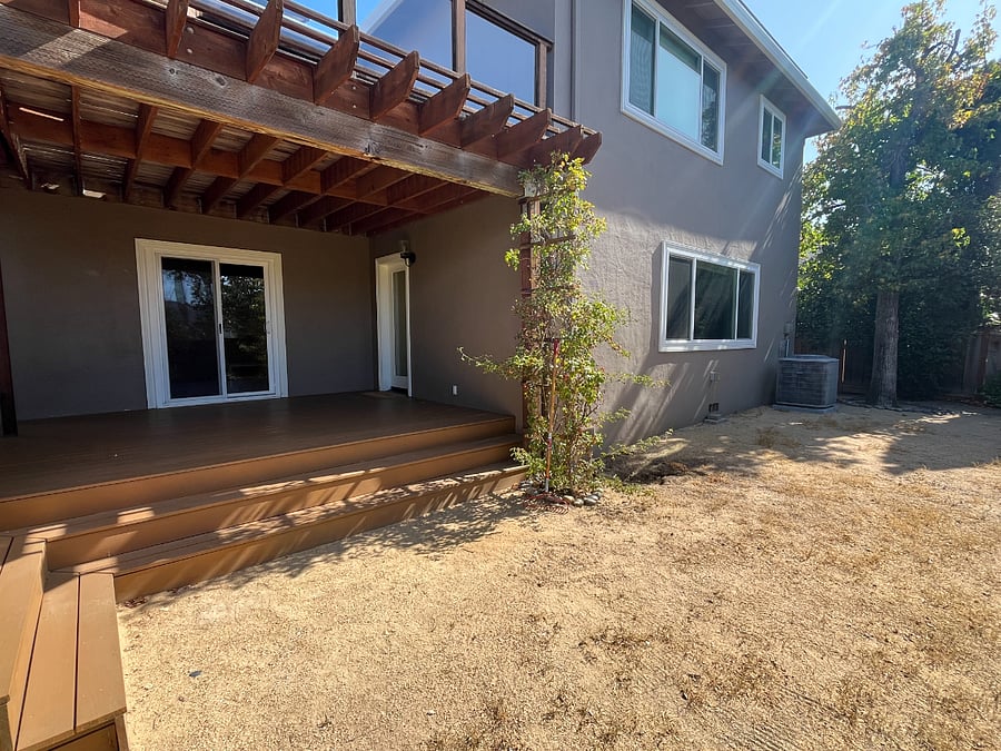Lower deck, entry door, and garden.
