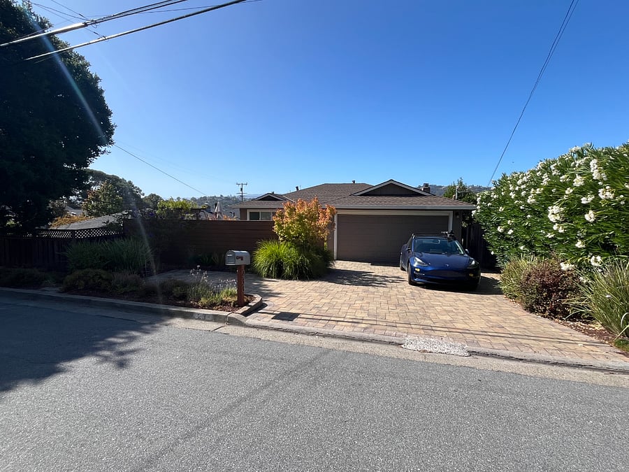 Front street view of house with ADU as separate unit downstairs.