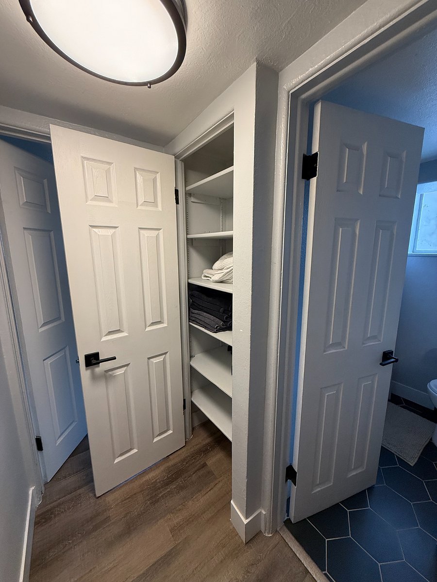 Linen closet next to bathroom