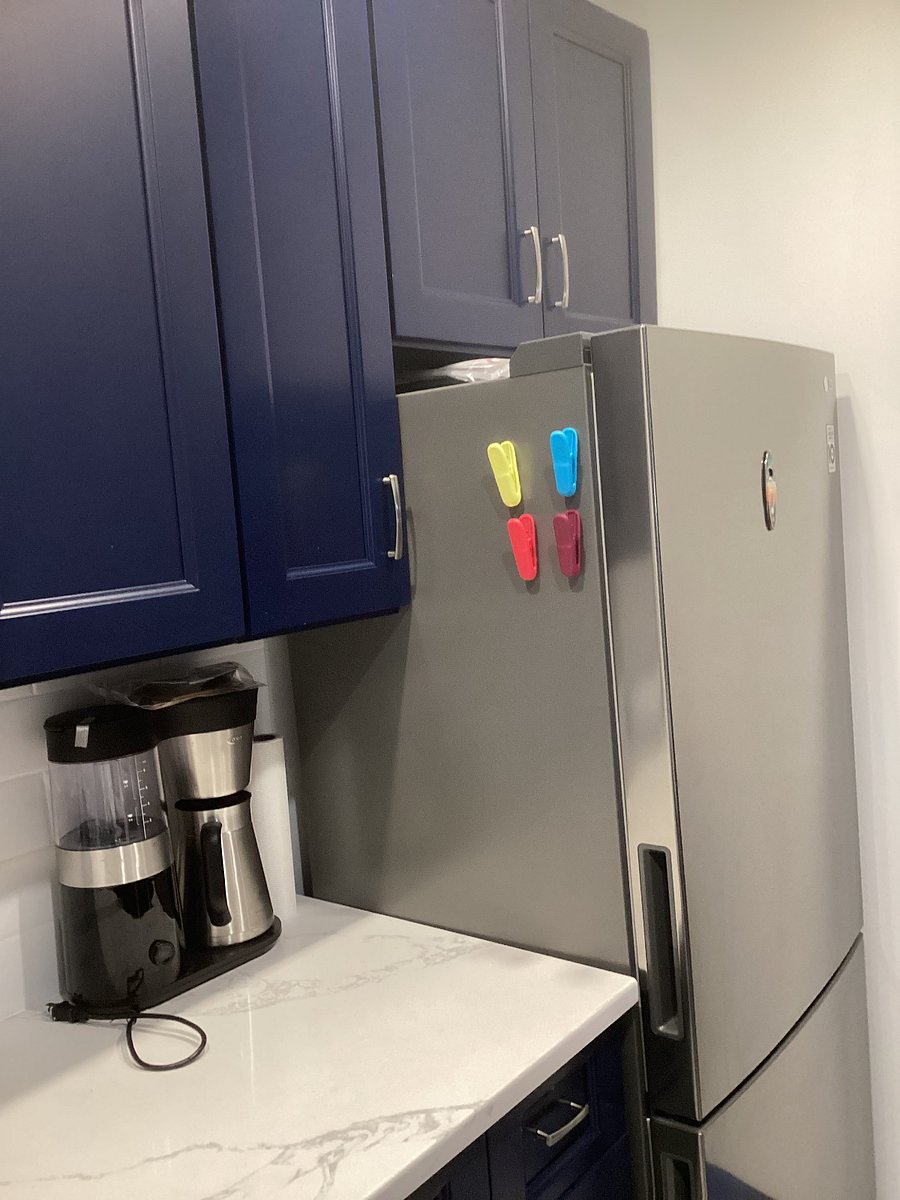 NEW REFRIGERATOR AND COUNTER TOP SPACE FOR PREPARING FOOD.