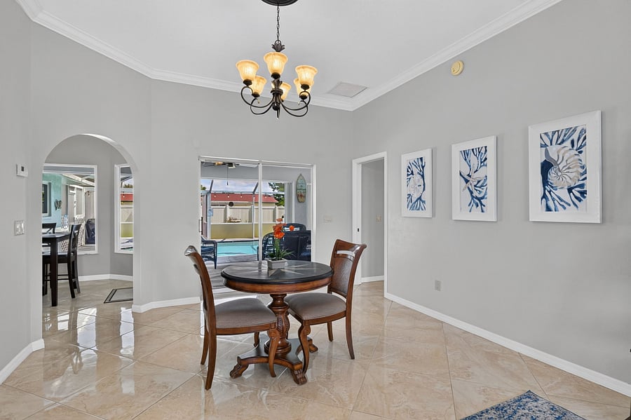 Rear view of from great room overlooking pool and lot's of SUNSHINE!