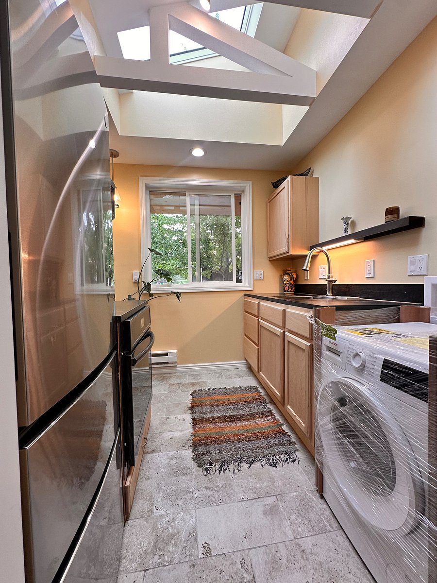 Will have stacked dryer. All appliances are new. Skylights and open beams create a bright and open feeling.