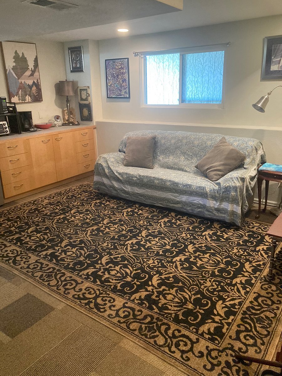 Living space... couch with reclining feature on both sides. Coffee table and reading light
