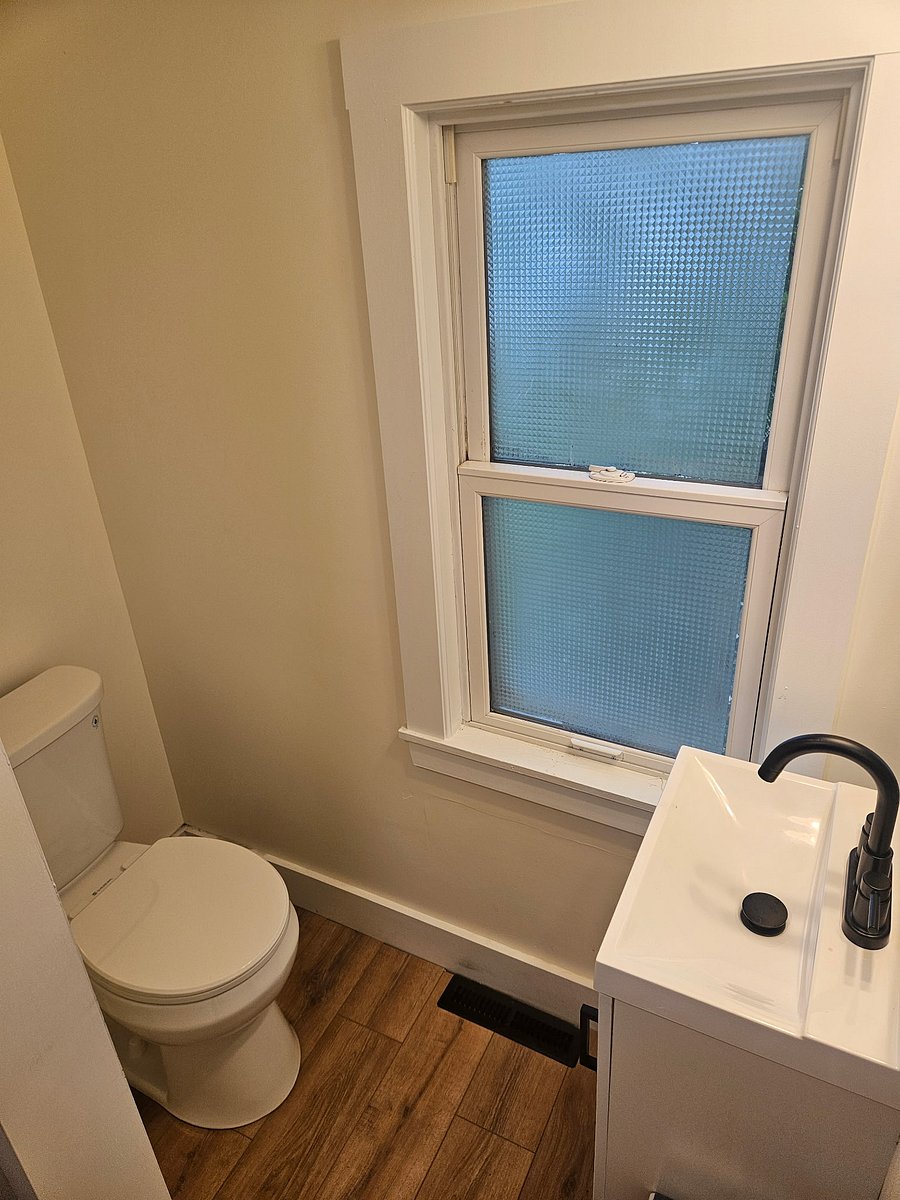 Full bathroom with a standing shower