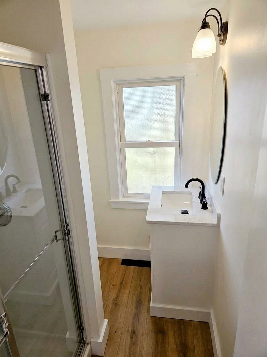 Full bathroom with a standing shower