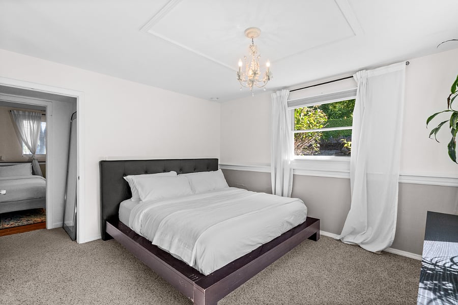 The spacious lower level bedroom features a comfortable king size bed. 
