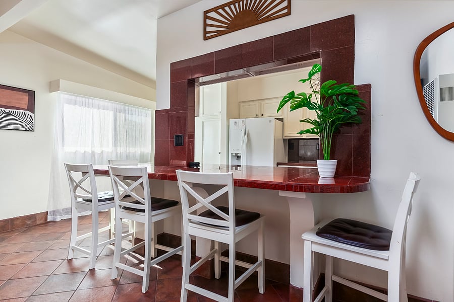 Island: Serve, gather, and connect from this generous tiled counter with seating