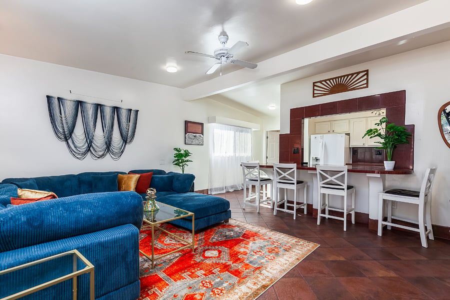 Living Room: The living room flows seamlessly into the kitchen and breakfast bar for easy everyday living