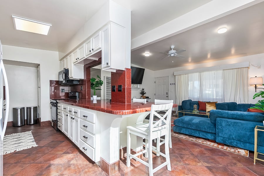 Island: Bright natural light and bar seating make this dining space feel warm and inviting