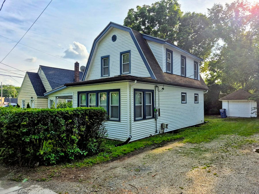 Exterior and driveway w/ garage