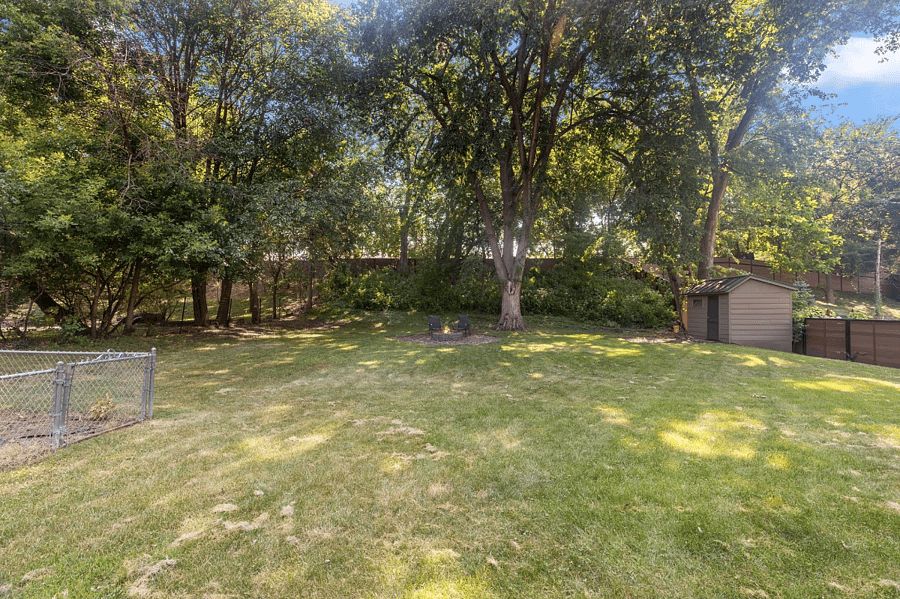 Fully fenced backyard with fire pit + wood in shed