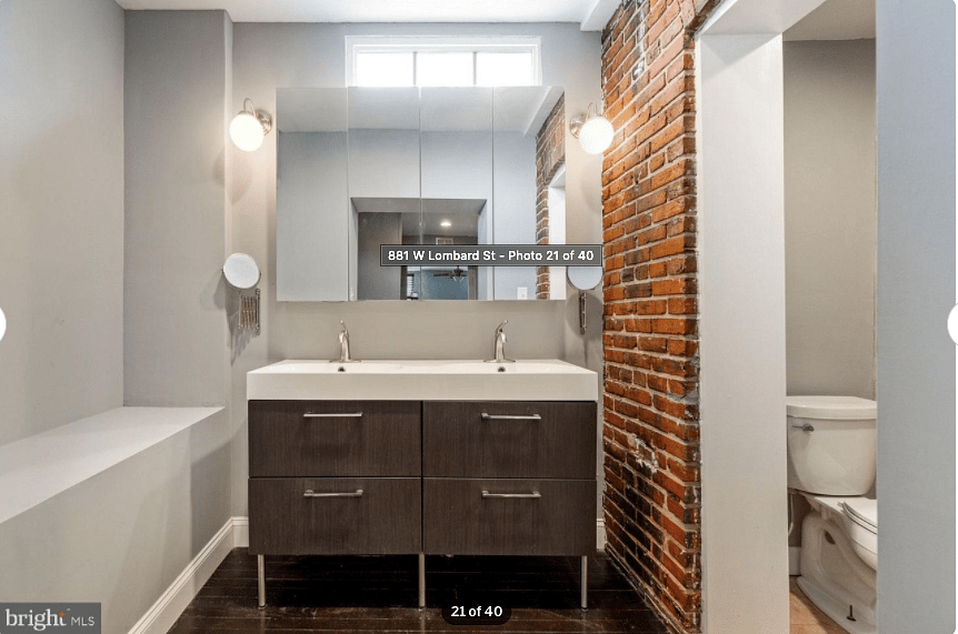 Fully furnished master bedroom with a full station work desk / chair. 