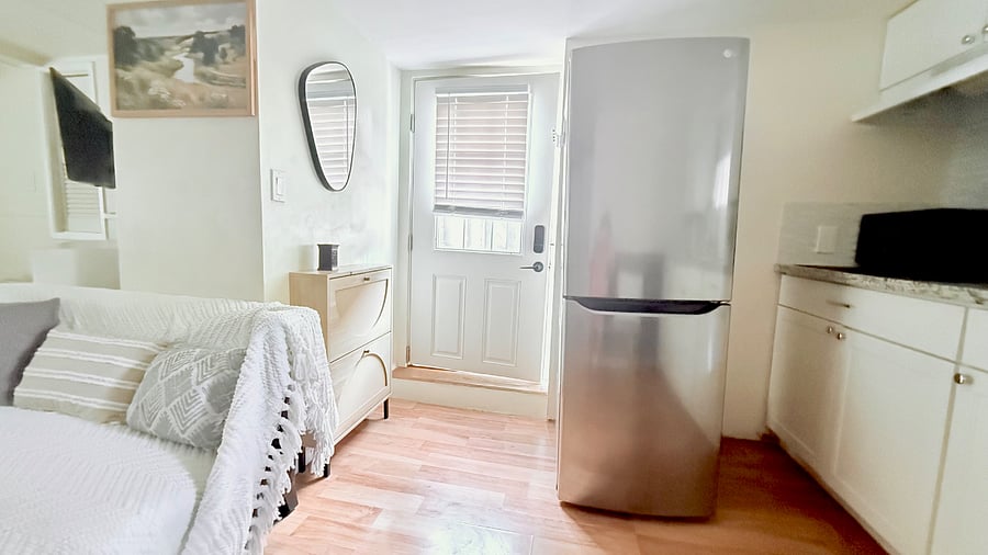 Welcoming entrance, you can let more natural light in by lifting the shades. The shoe cabinet by the entrance makes it convenient to keep your space clean and feeling like home.