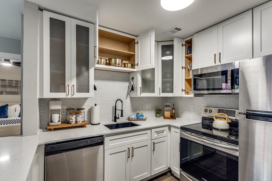 Alternate view of the fully equipped kitchen looking toward the dining and prep spaces