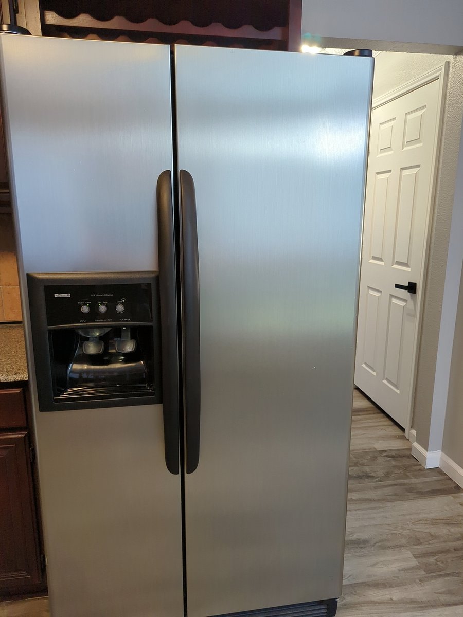 Side by Side Fridge and Freezer Combo with Ice maker and water dispenser.