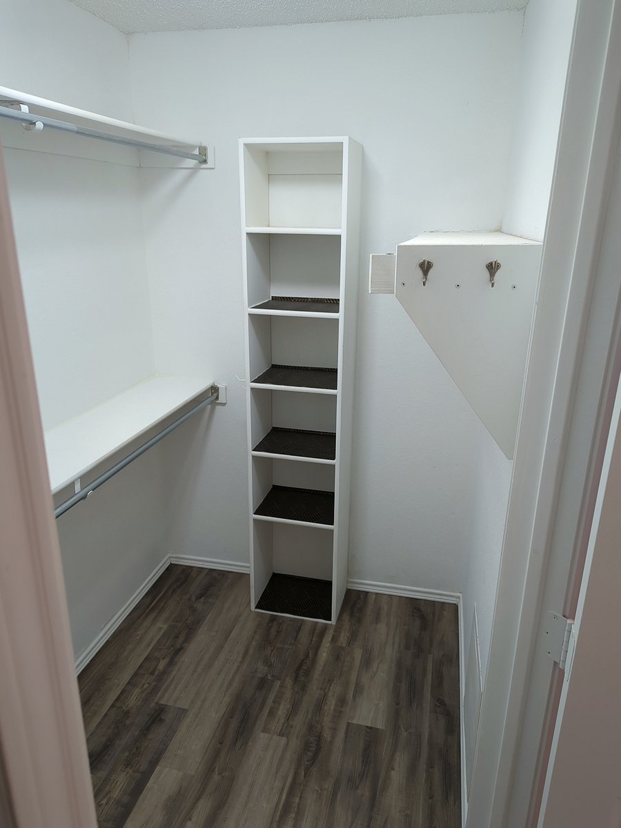 Primary walk-in closet.