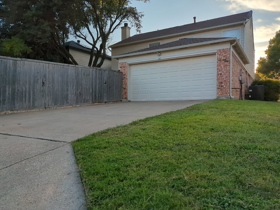 2-car garage with 2 car driveway accessible via alley.