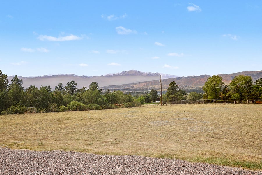 Enjoy breathtaking views of Pikes Peak and the Front Range from this spacious property, offering a peaceful, quiet setting with plenty of open space.