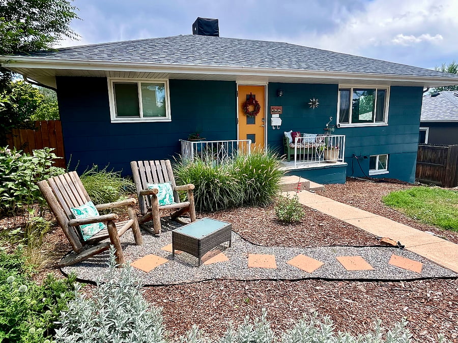 Front of house with access to upstairs unit