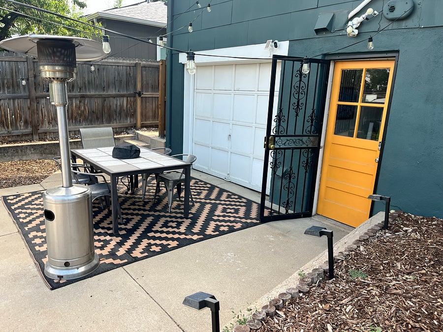 Outdoor dining area and private entrance to lower unit