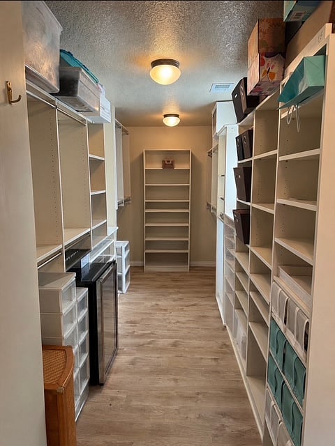 His side of primary closet