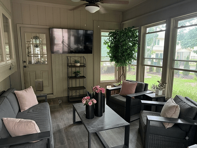 Sun Porch.  Windows open and sliding door opens out to the patio.  Great for evening movies and coffee in the morning. 