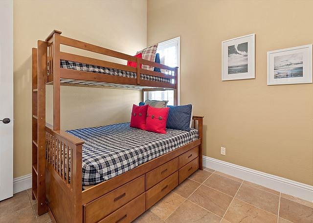 Bunk room includes trundle bed for extra space