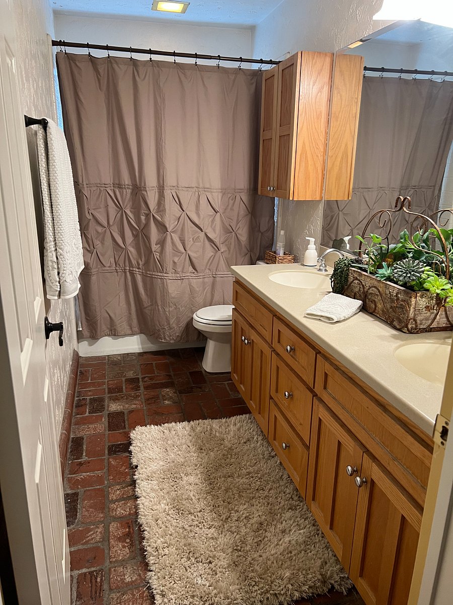Shared bathroom with double sinks