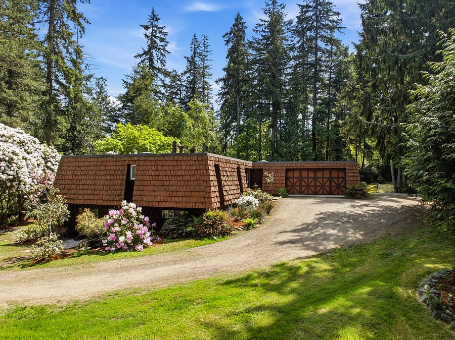 Exterior with cedar plank siding, cut from property
