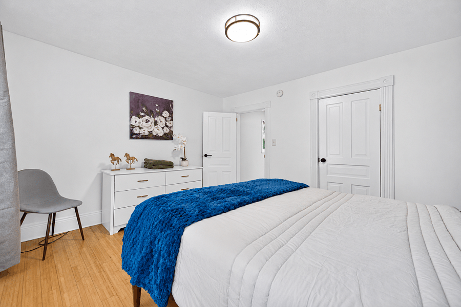 Primary bedroom with dresser and closet space