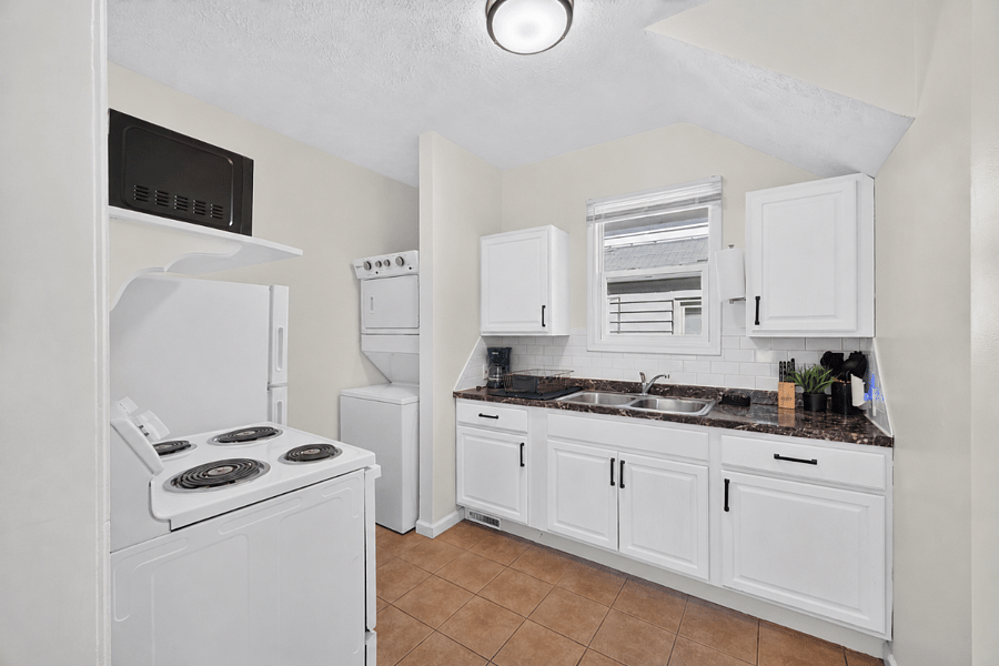 Full kitchen with in-unit washer and dryer, fully stocked for cooking