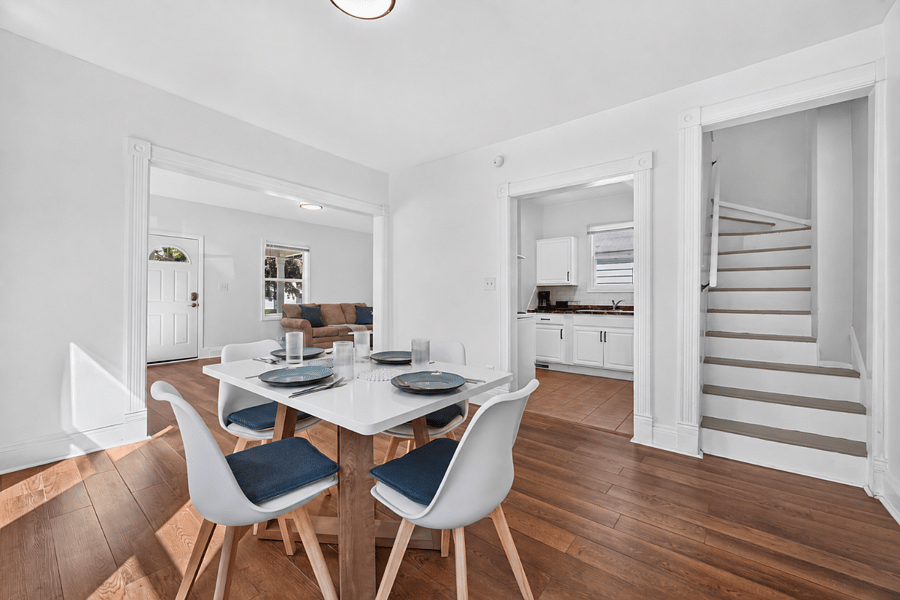 Dining room seats four, with the kitchen and stairs to the bedrooms