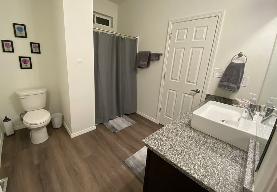 First floor full bathroom. Accessible from living area and first floor master bedroom