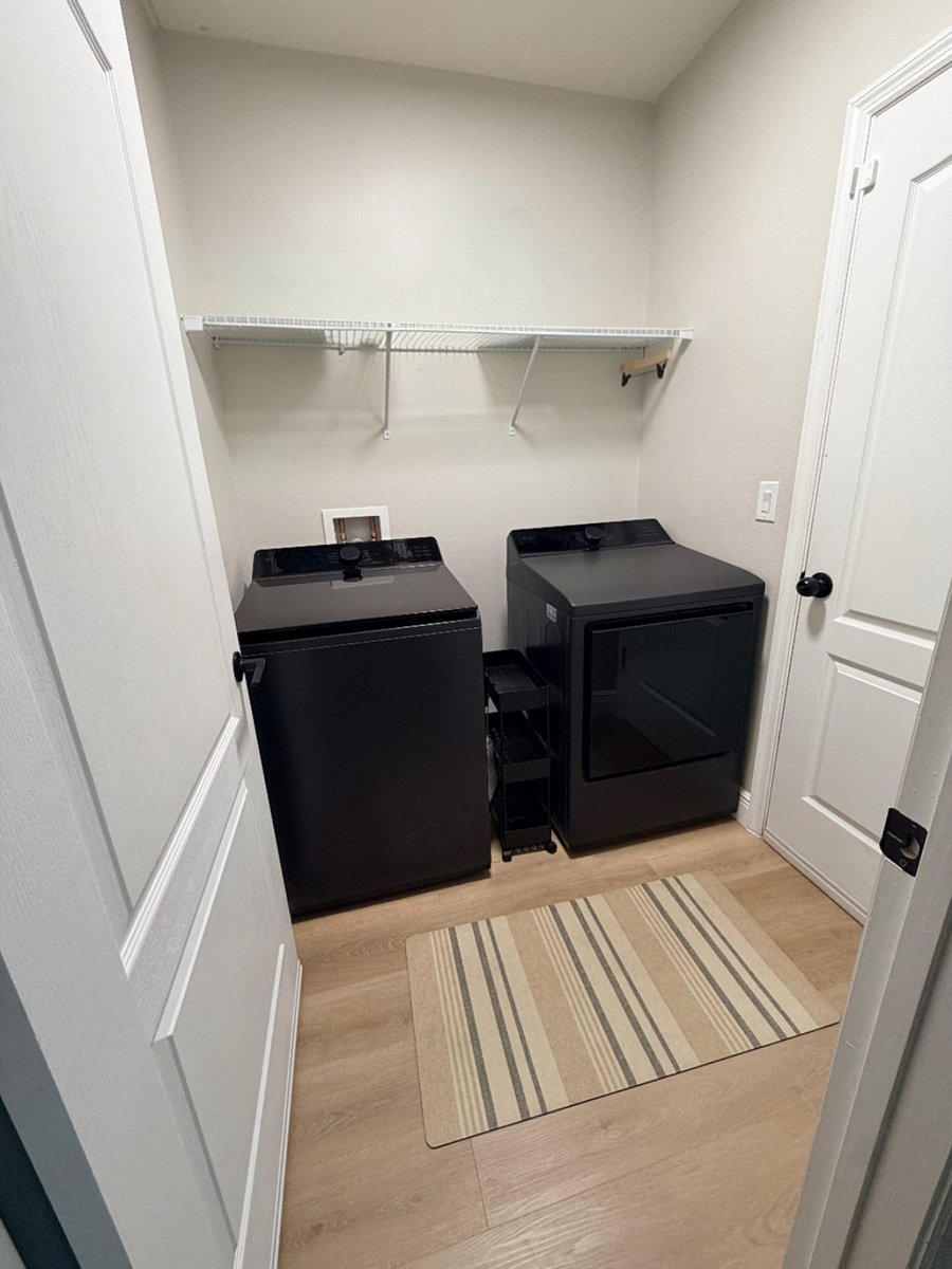 Laundry room next to garage 
