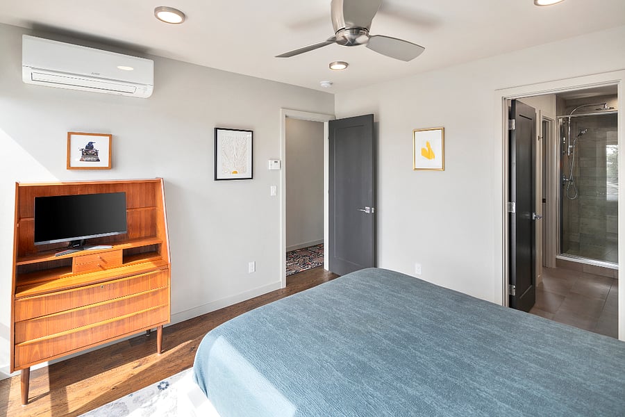 Primary suite with desk and monitor