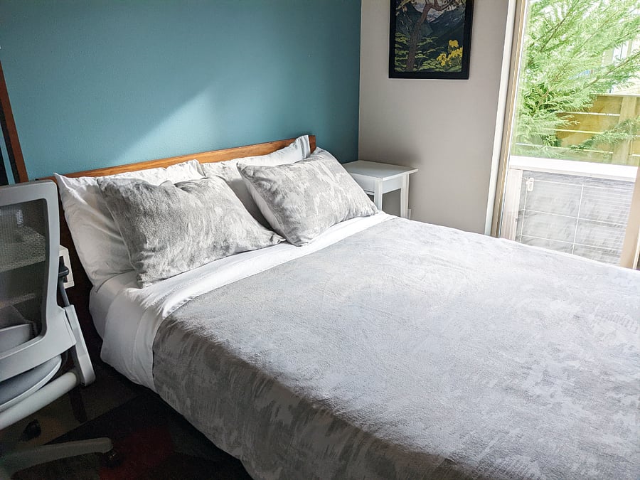 Front bedroom with sliding doors to a small yard