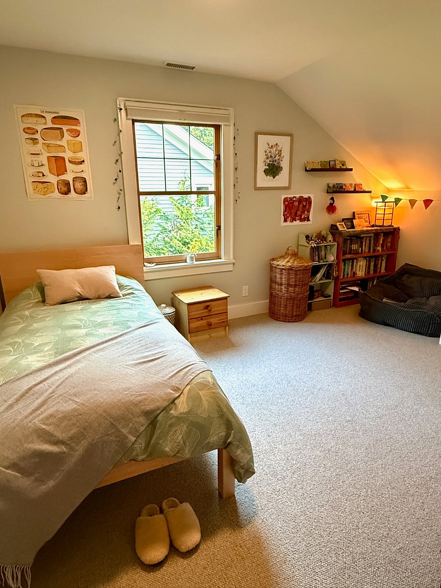 Bedroom with twin bed. 2 identical bedrooms upstairs with shared bathroom.
