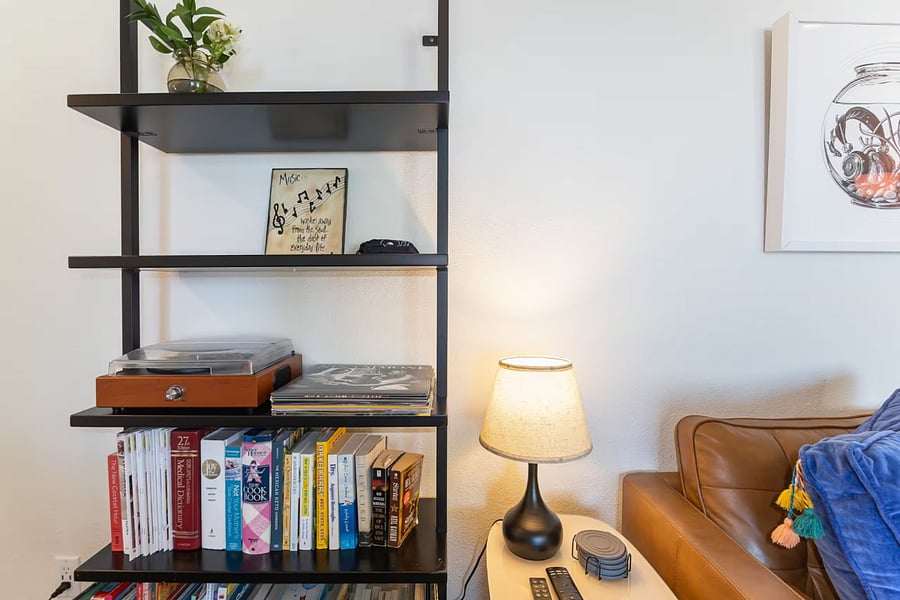 Bookshelf with a record player in the mainfloor living room.