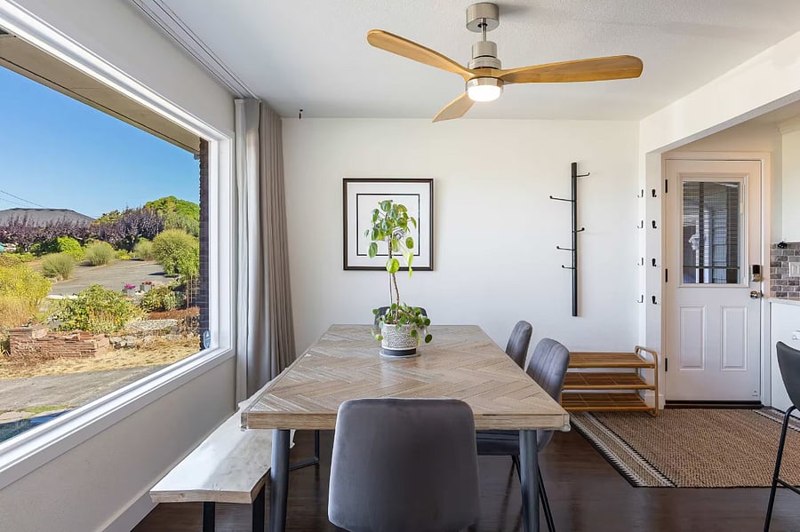 Dining table seats 8. Handmade wood bench adds character.