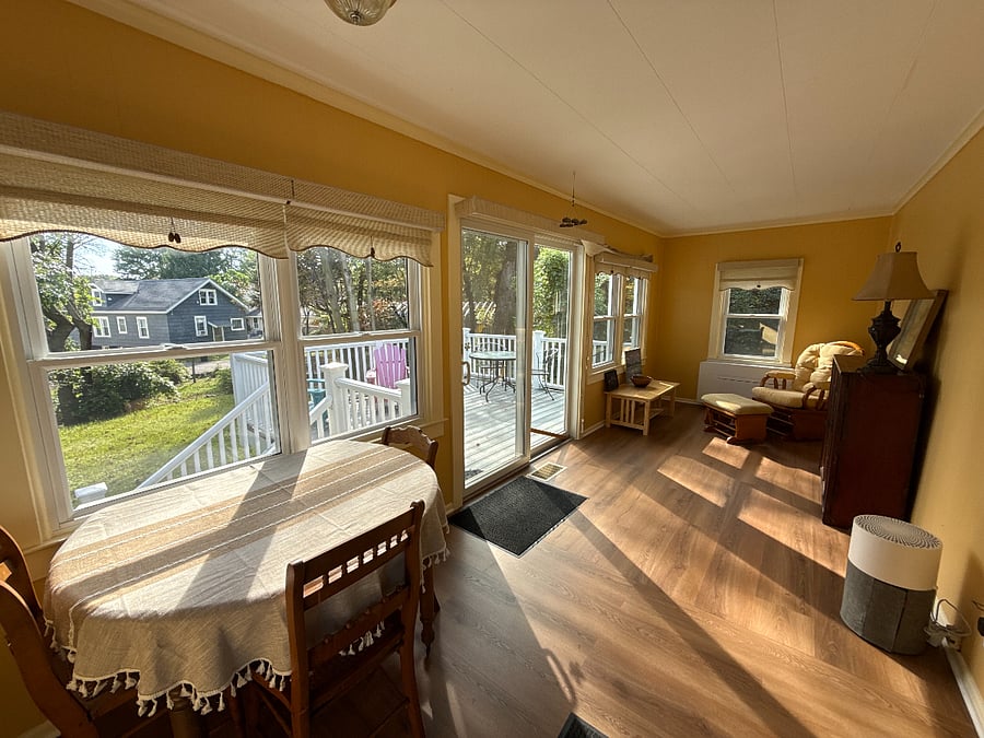 Sunroom off the back of the house faces east for natural morning light.it is right off the kitchen and rear entry. It features an innovative heat pump system that is whisper quiet and will heat or cool keeping you comfortable. 