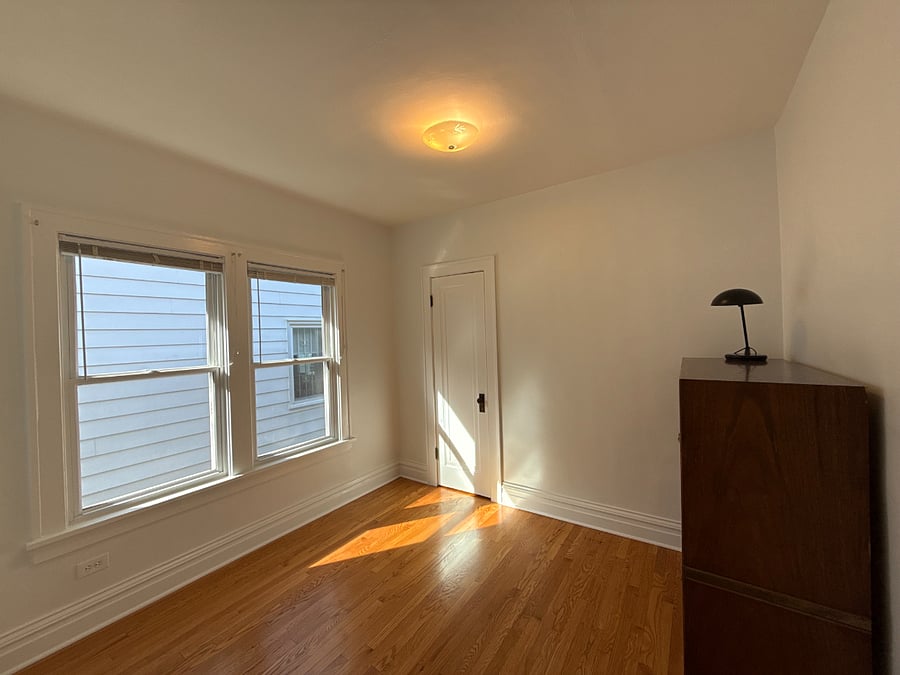 Bedroom two, soon to have blackout curtains and a queen-size mattress.
