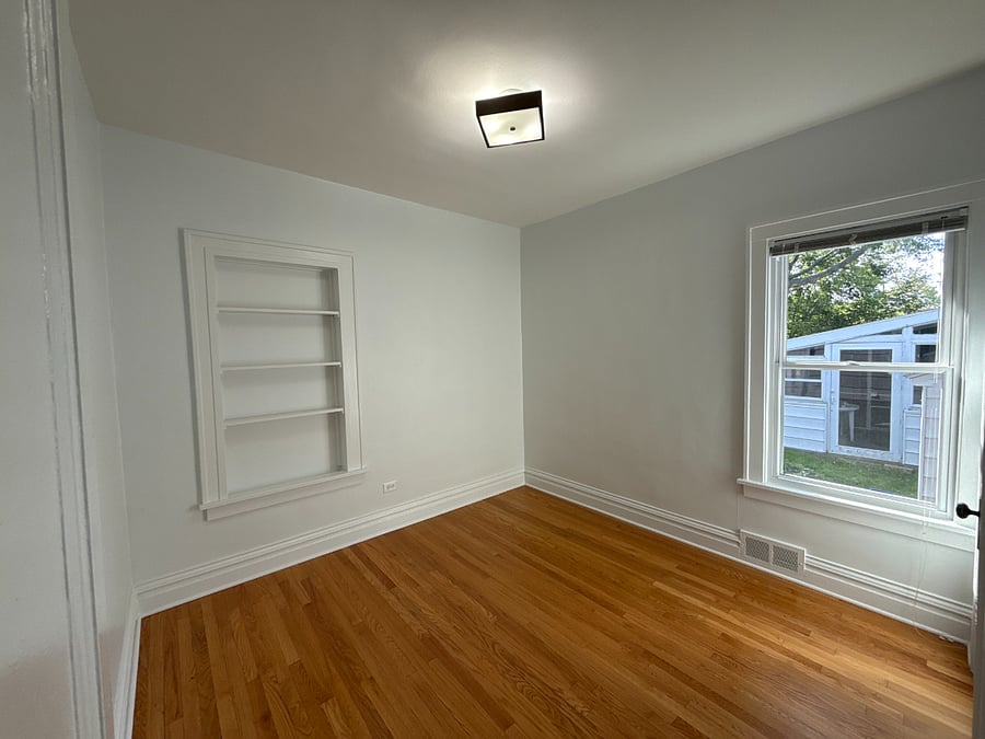 Bedroom one, soon to have blackout curtains and a full-size mattress. 
