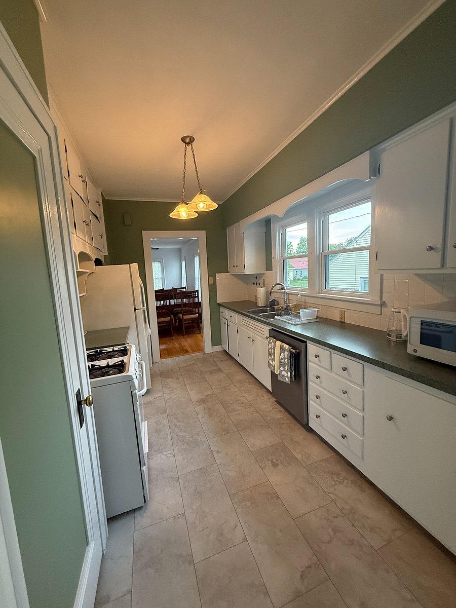 The kitchen is laid out well with plenty of counter space and light. It has a brand-new dishwasher, the fridge and stove are newer and have been cleaned and serviced. 