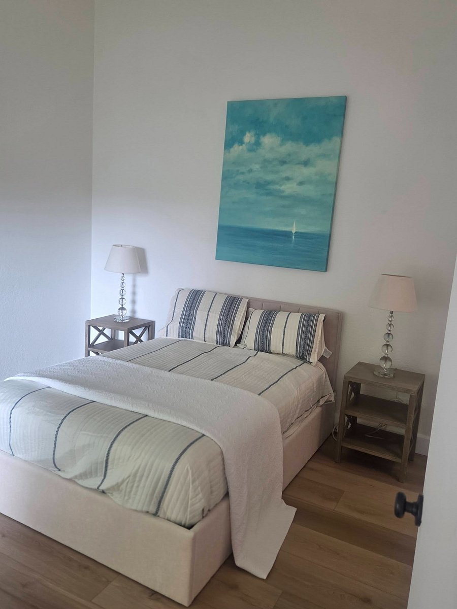 Master bedroom with bed, desk, lazy boy recliner 2 full sized closets with built in dresser