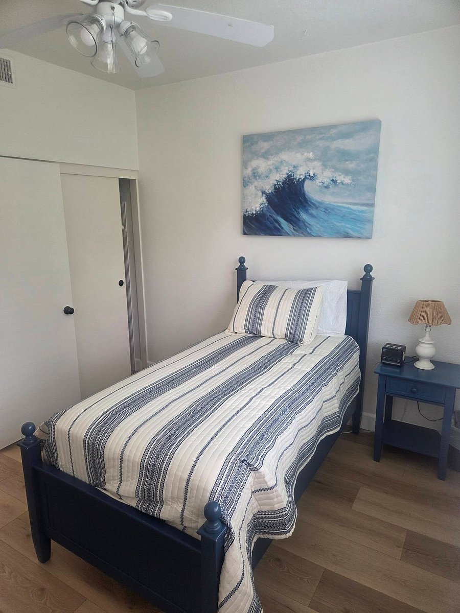 Private room with twin bed, desk and full sized closet
