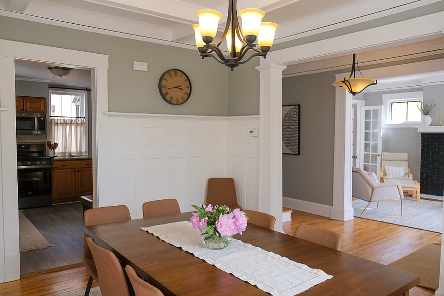 The spacious dining room is ready for family meals, morning coffee, board games, or an additional work area, with comfortable seating and an easy connection to the kitchen and living room.