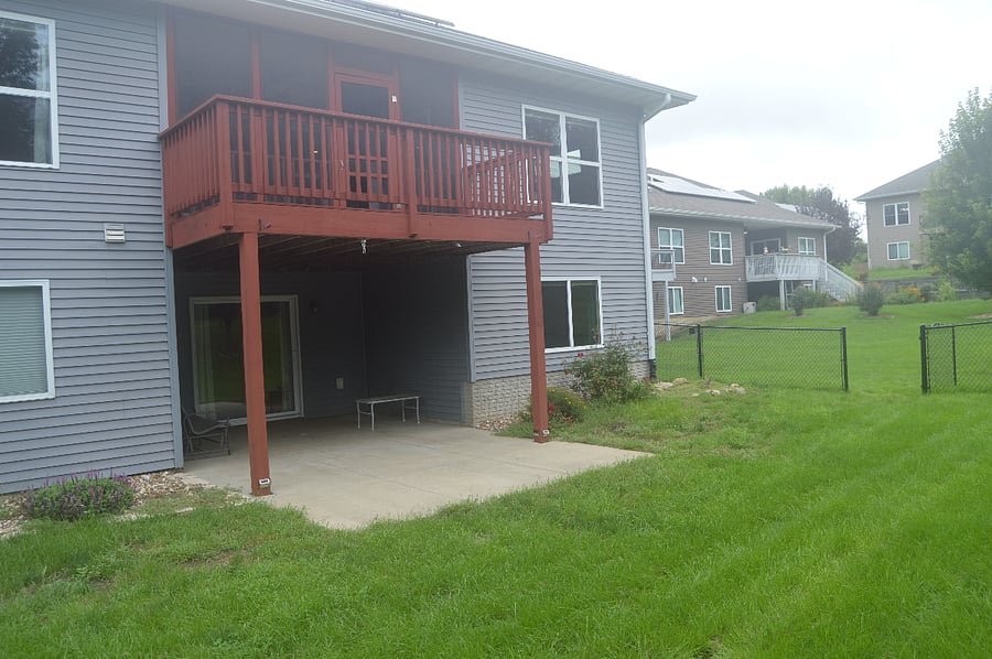 back yard with screened in porch above walk out basement