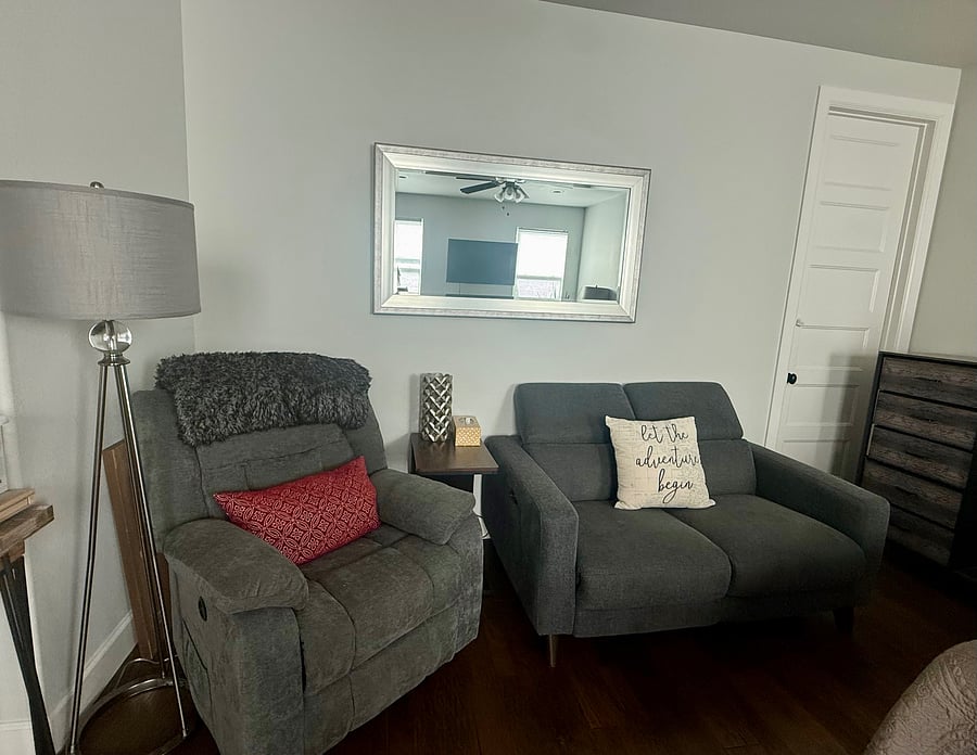 Electric adjustable recliner and loveseat.