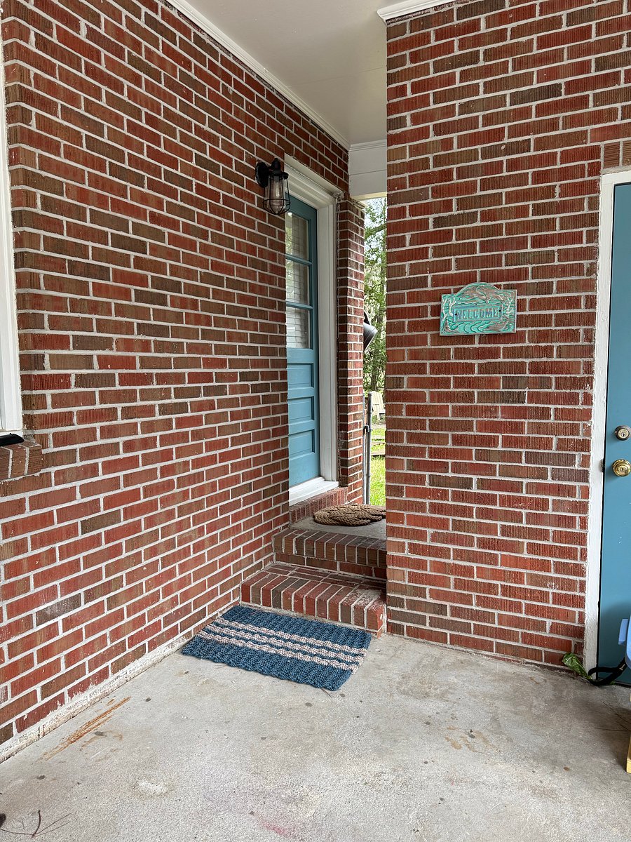 Side entry door under the carport; opens into the kitchen.